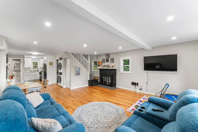 a living room with furniture and a flat screen tv