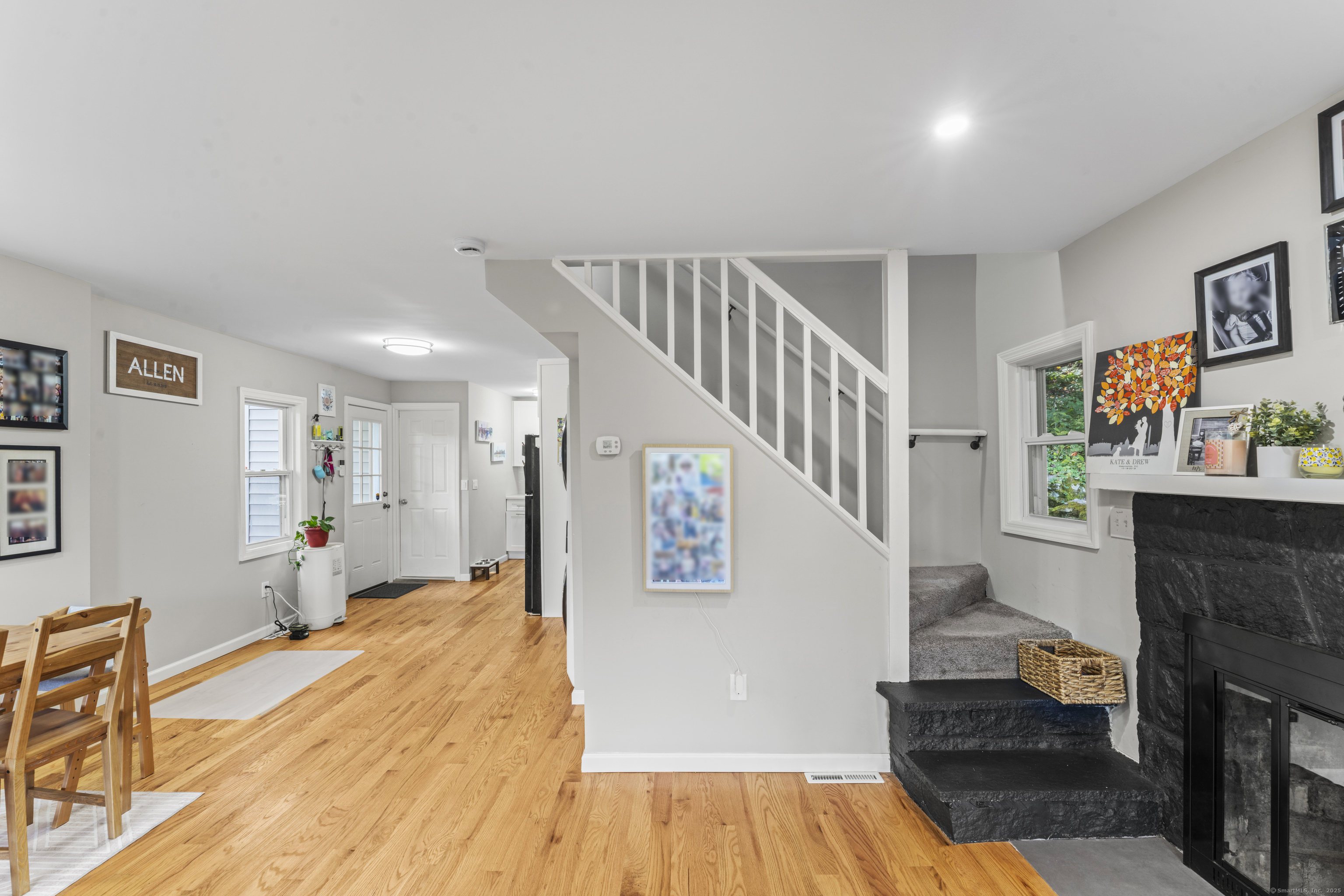 199 Riverside Road Newtown, CT 06482 - Photo 8 of 28 a living room with furniture and a fireplace