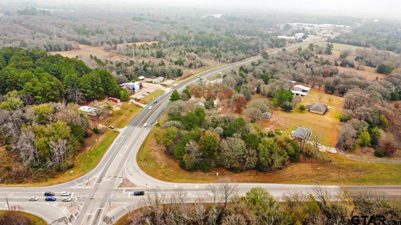 564 West Loop 564 Mineola, TX 75773 - Photo 7 of 10 an aerial view of a house with a yard and lake view