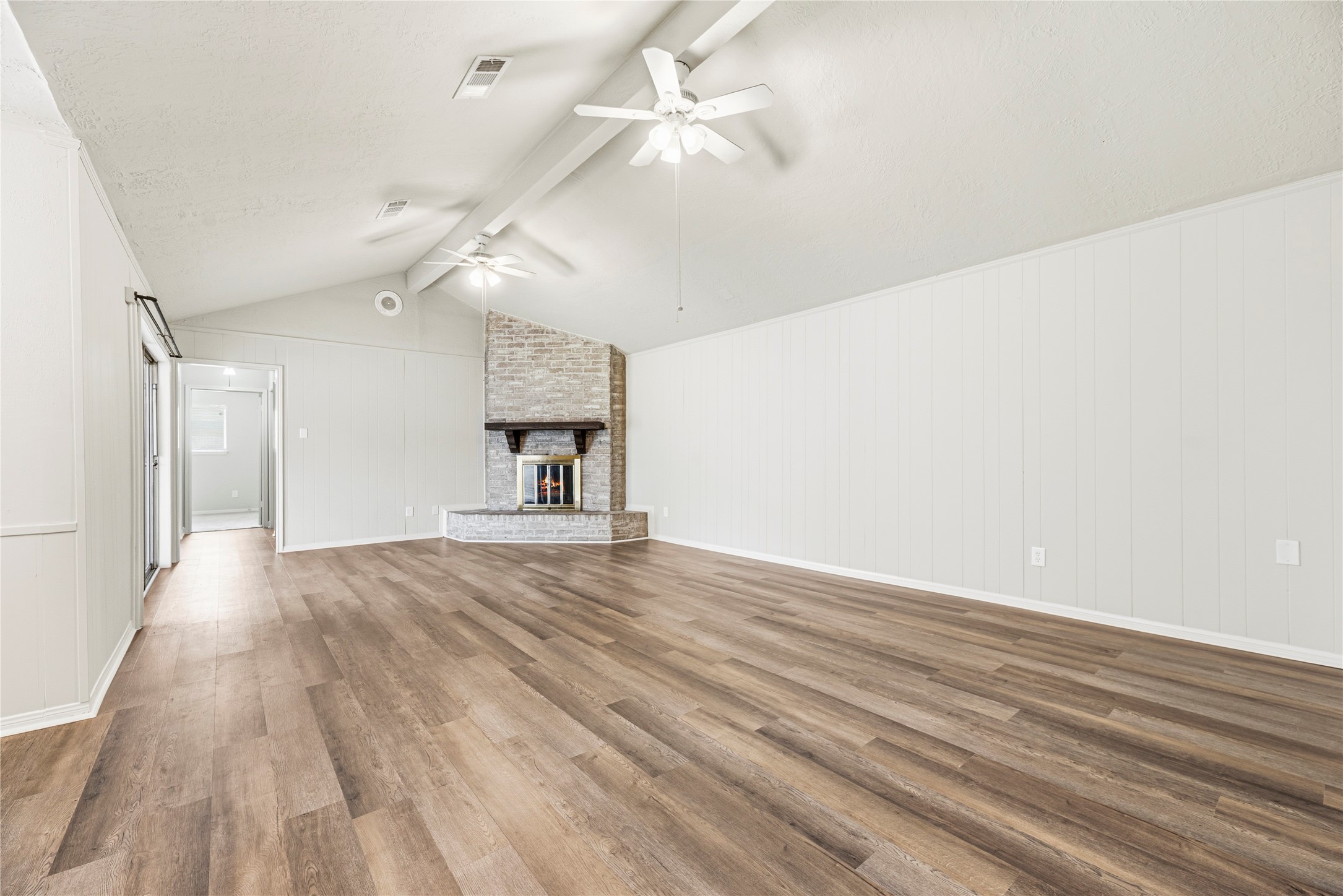 6931 Sandy Knolls Drive Spring, TX 77379 - Photo 3 of 21 This spacious living room features high vaulted ceilings with beams, a cozy brick fireplace, brand new vinyl flooring throughout and ceiling fans for comfort.
**6931 Sandy Knolls Dr., Spring, TX 77379**
