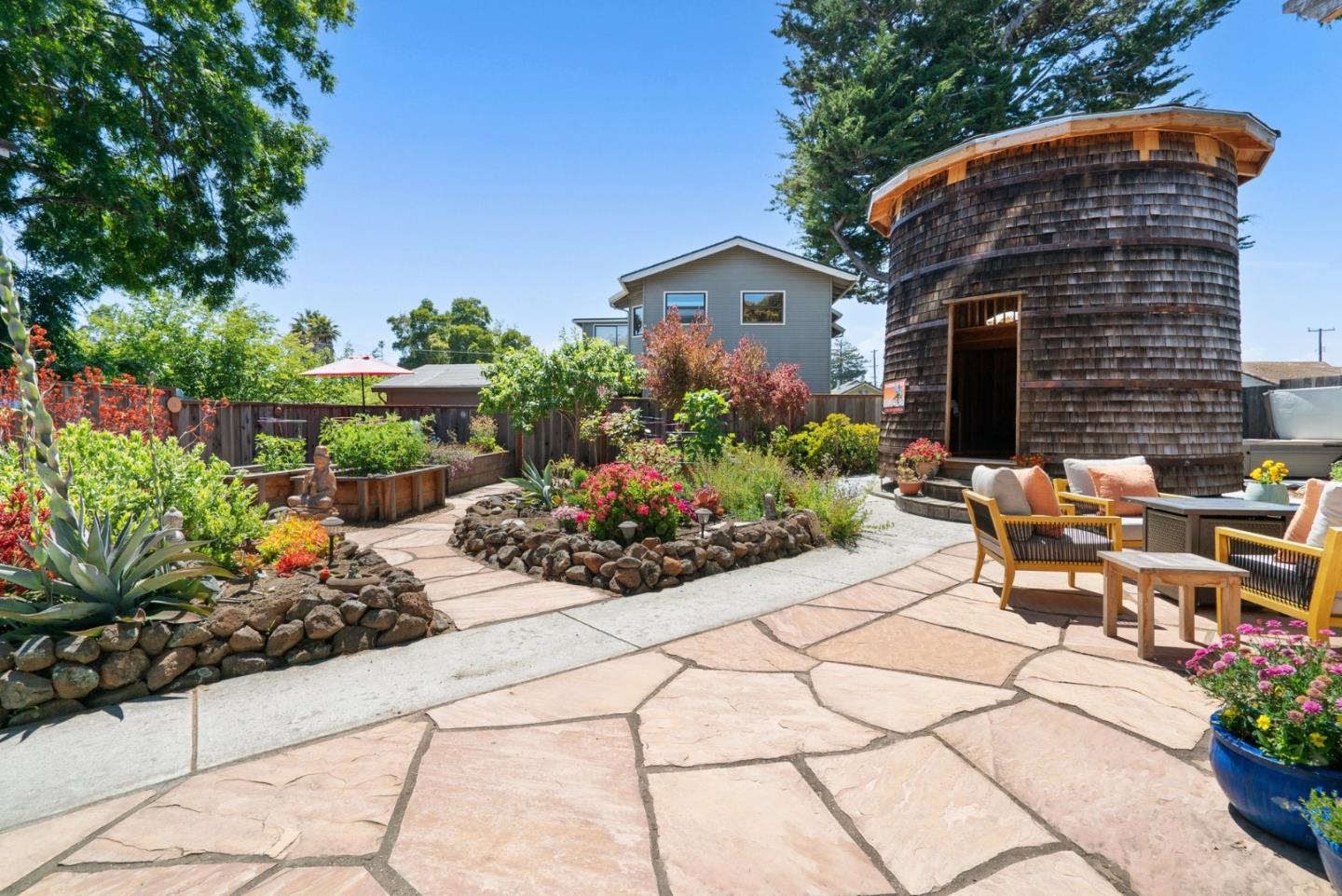 505 Cayuga Street Santa Cruz, CA 95062 - Photo 30 of 57 a view of a chairs and table in a backyard