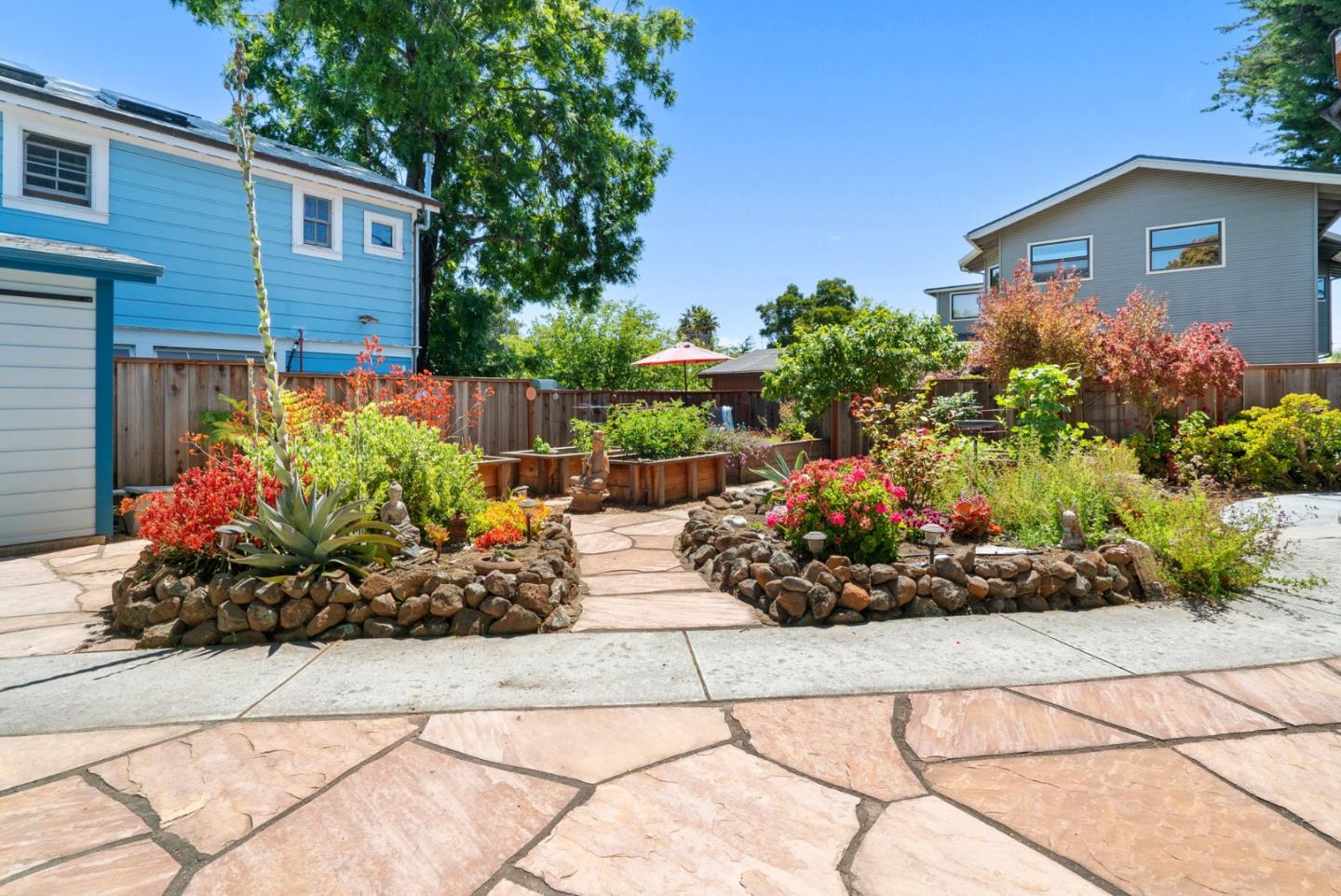 505 Cayuga Street Santa Cruz, CA 95062 - Photo 35 of 57 a view of a chairs and a flower in a yard