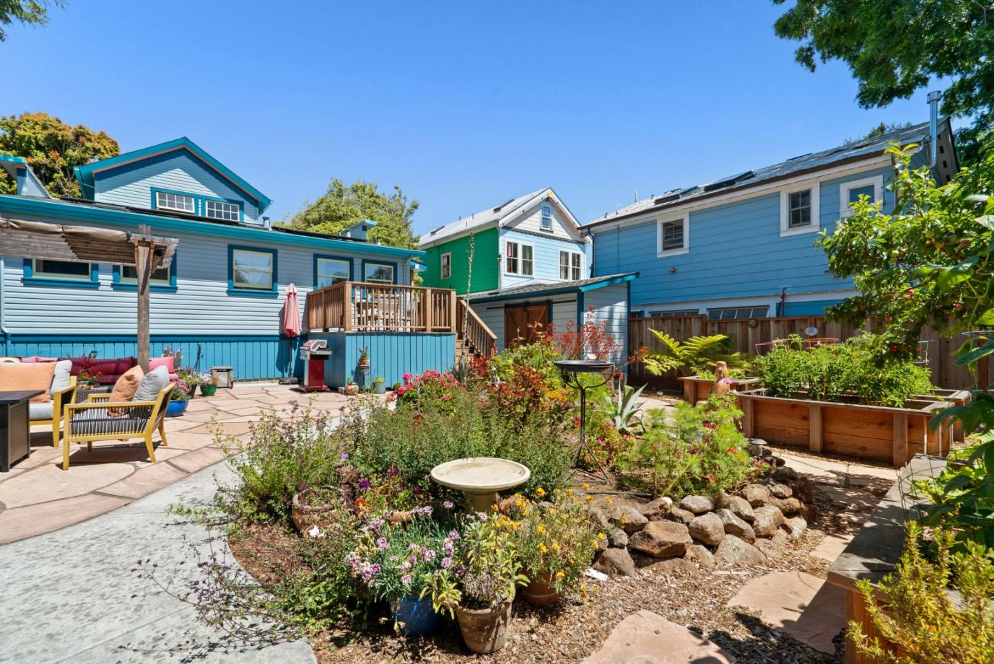 505 Cayuga Street Santa Cruz, CA 95062 - Photo 38 of 57 a front view of a house with a yard and potted plants
