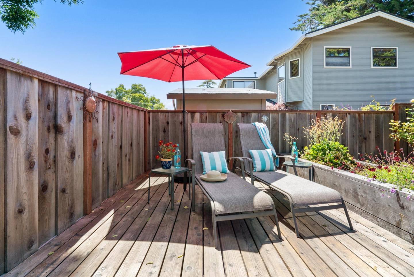 505 Cayuga Street Santa Cruz, CA 95062 - Photo 39 of 57 a view of a chairs and table on the wooden roof deck