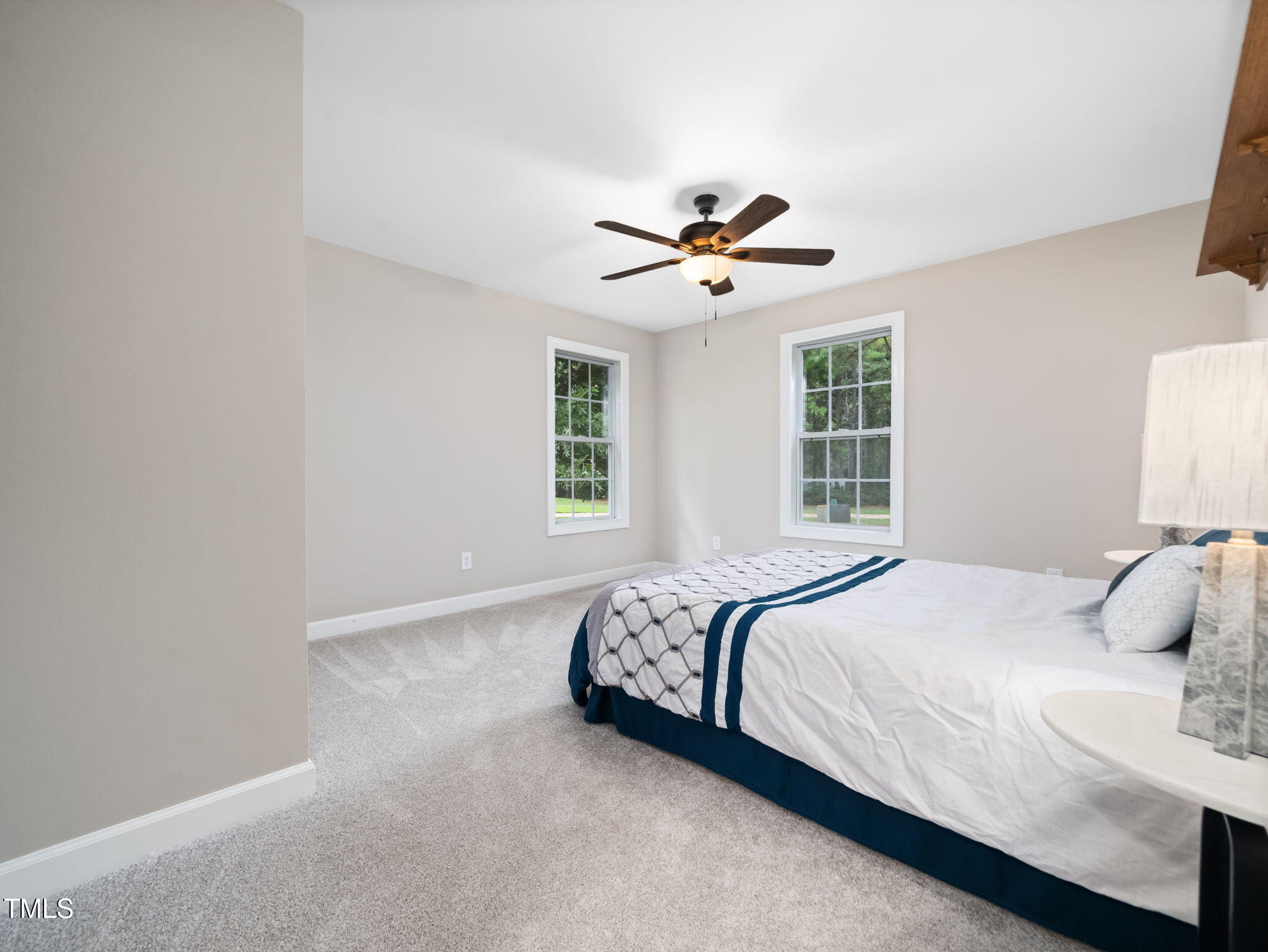 4700 Carolton Drive Raleigh, NC 27606 - Photo 17 of 29 a bedroom with a large bed and a window