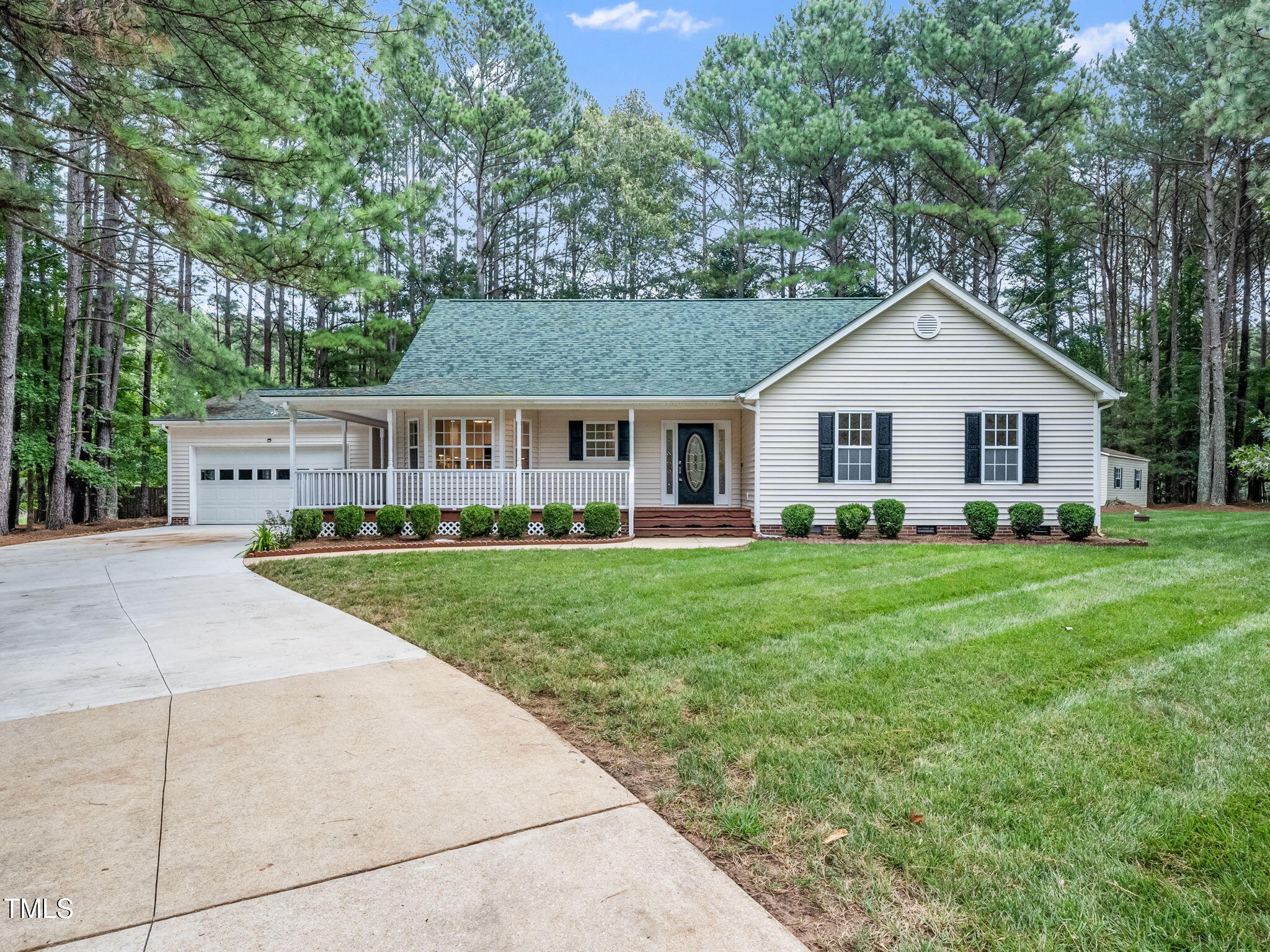 4700 Carolton Drive Raleigh, NC 27606 - Photo 21 of 29 a front view of a house with a yard