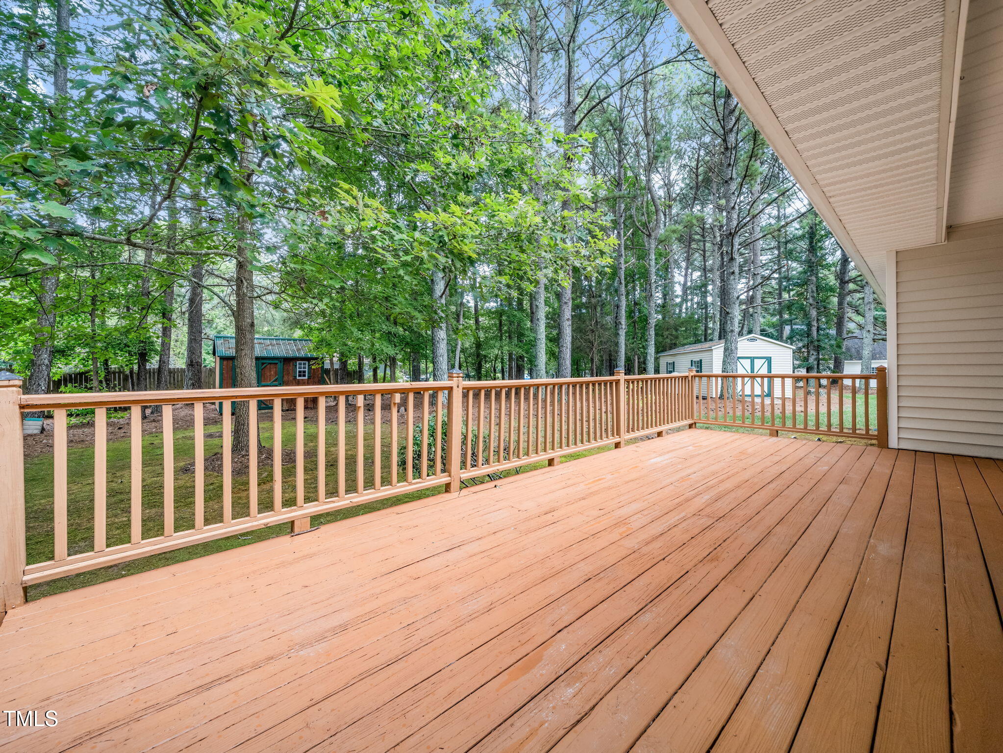 4700 Carolton Drive Raleigh, NC 27606 - Photo 22 of 29 a view of a wooden deck