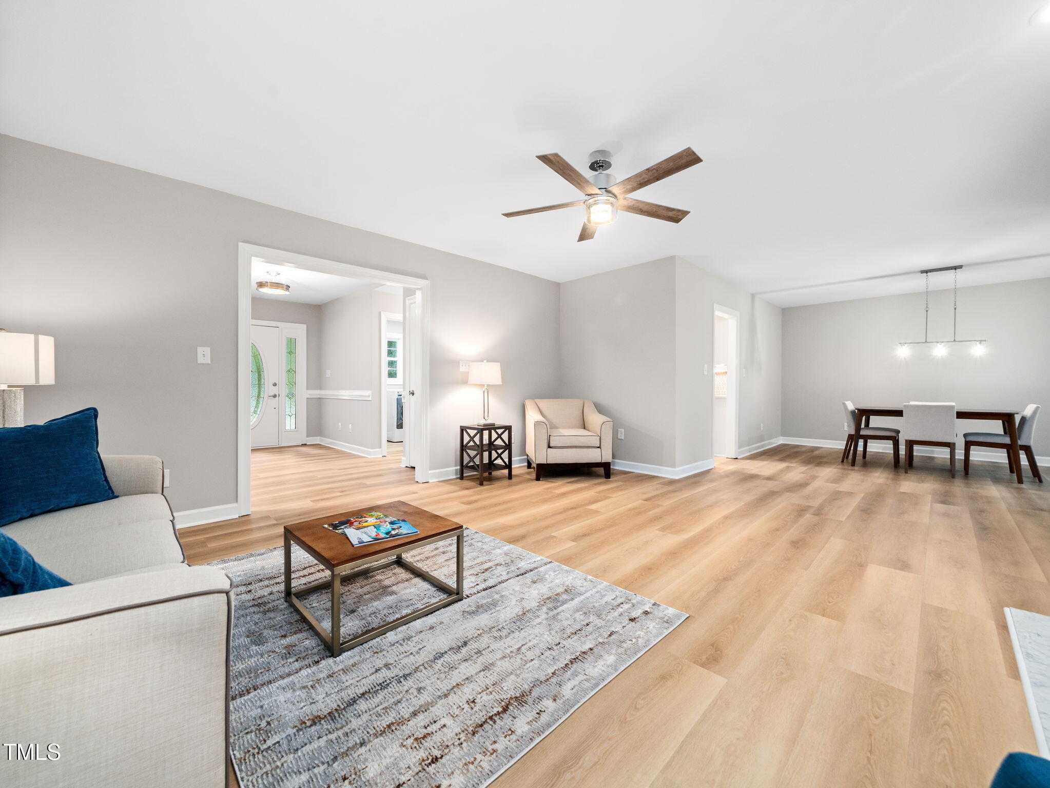 4700 Carolton Drive Raleigh, NC 27606 - Photo 8 of 29 a living room with furniture and a table