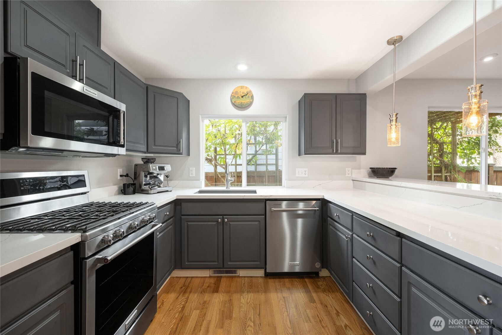 16267 16th Avenue Southwest Burien, WA 98166 - Photo 11 of 40 a kitchen with a sink stove and microwave