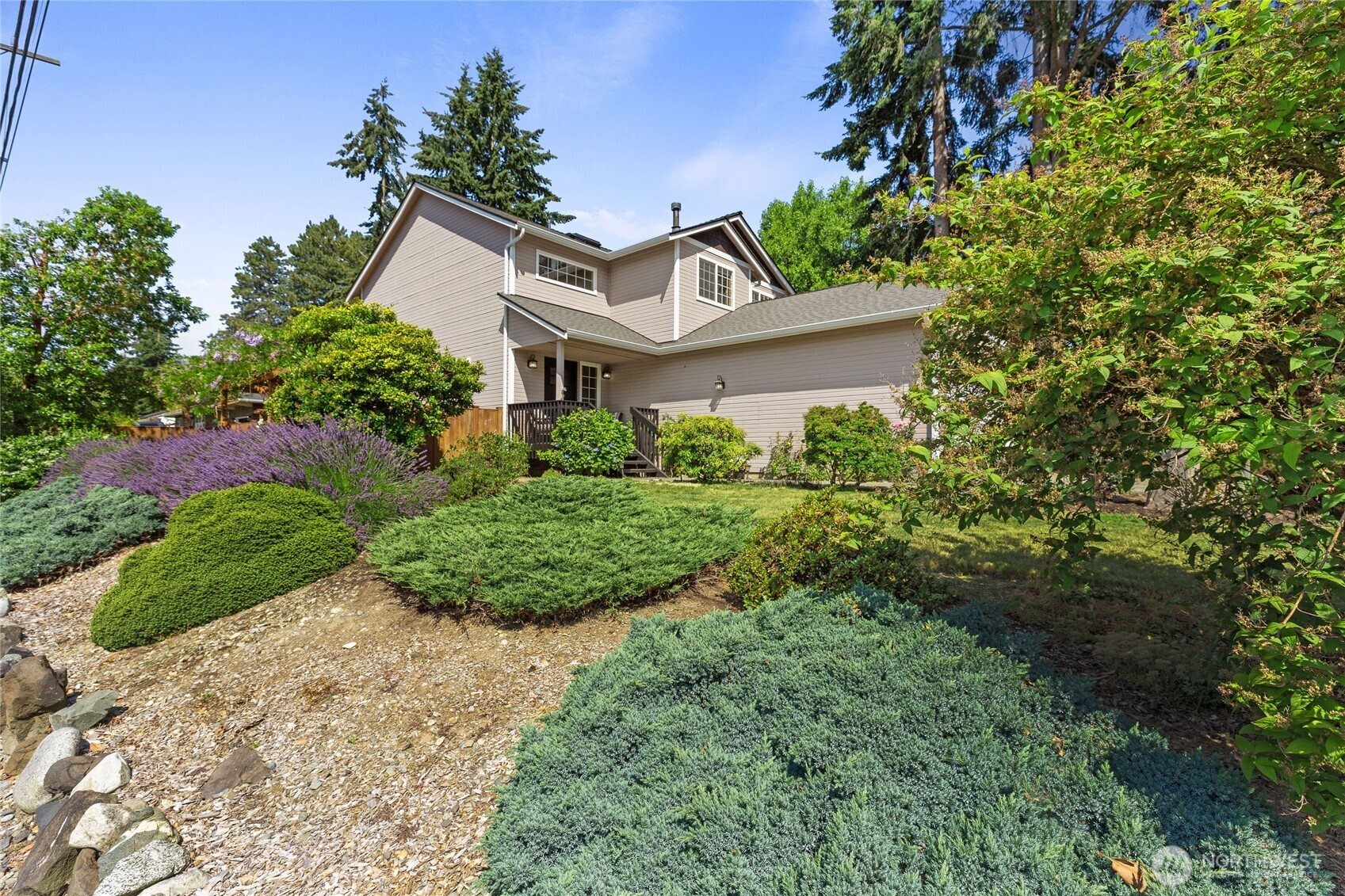 16267 16th Avenue Southwest Burien, WA 98166 - Photo 2 of 40 a view of a white house with a big yard and large tree