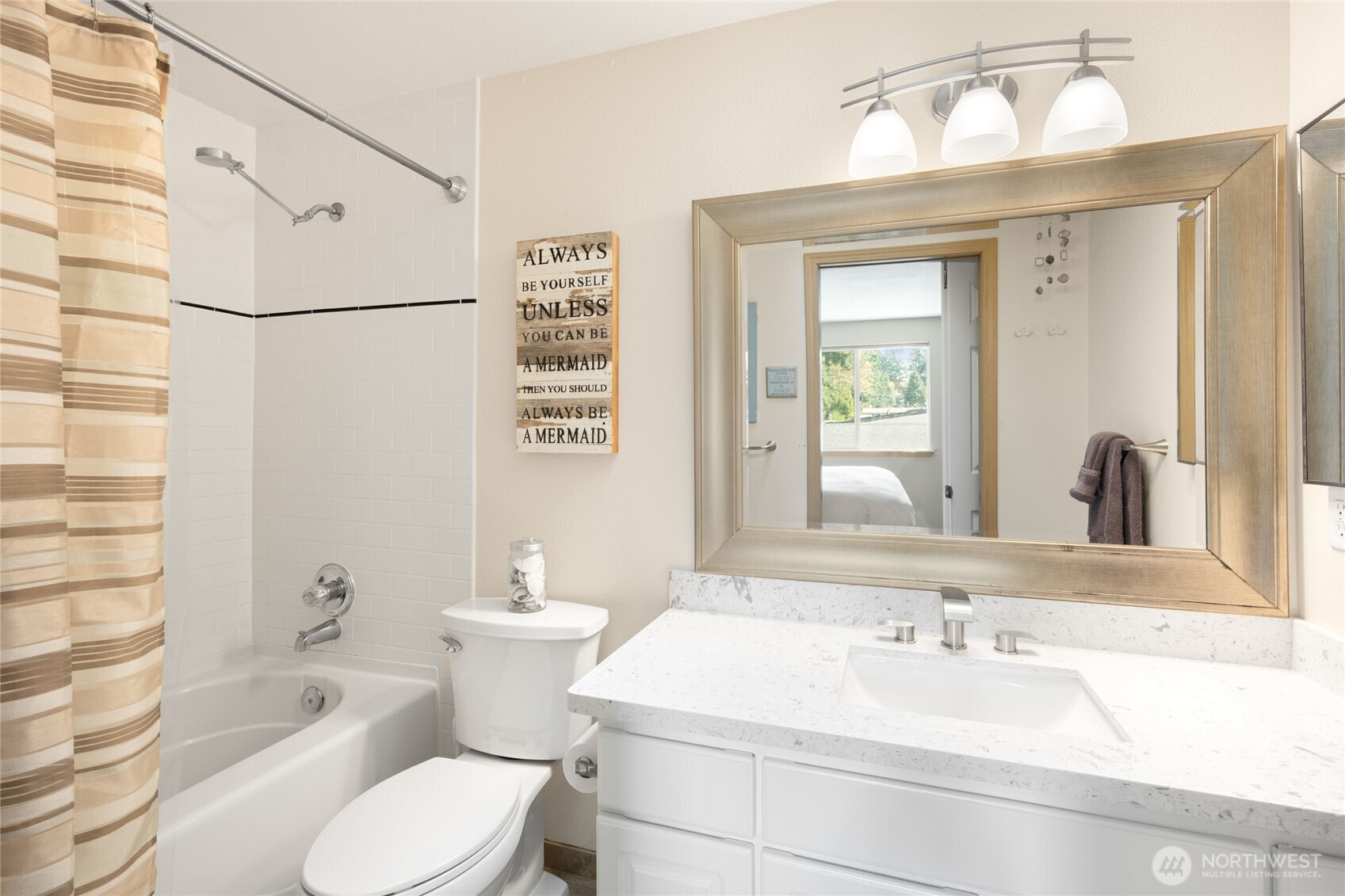 16267 16th Avenue Southwest Burien, WA 98166 - Photo 25 of 40 a bathroom with a sink toilet and shower