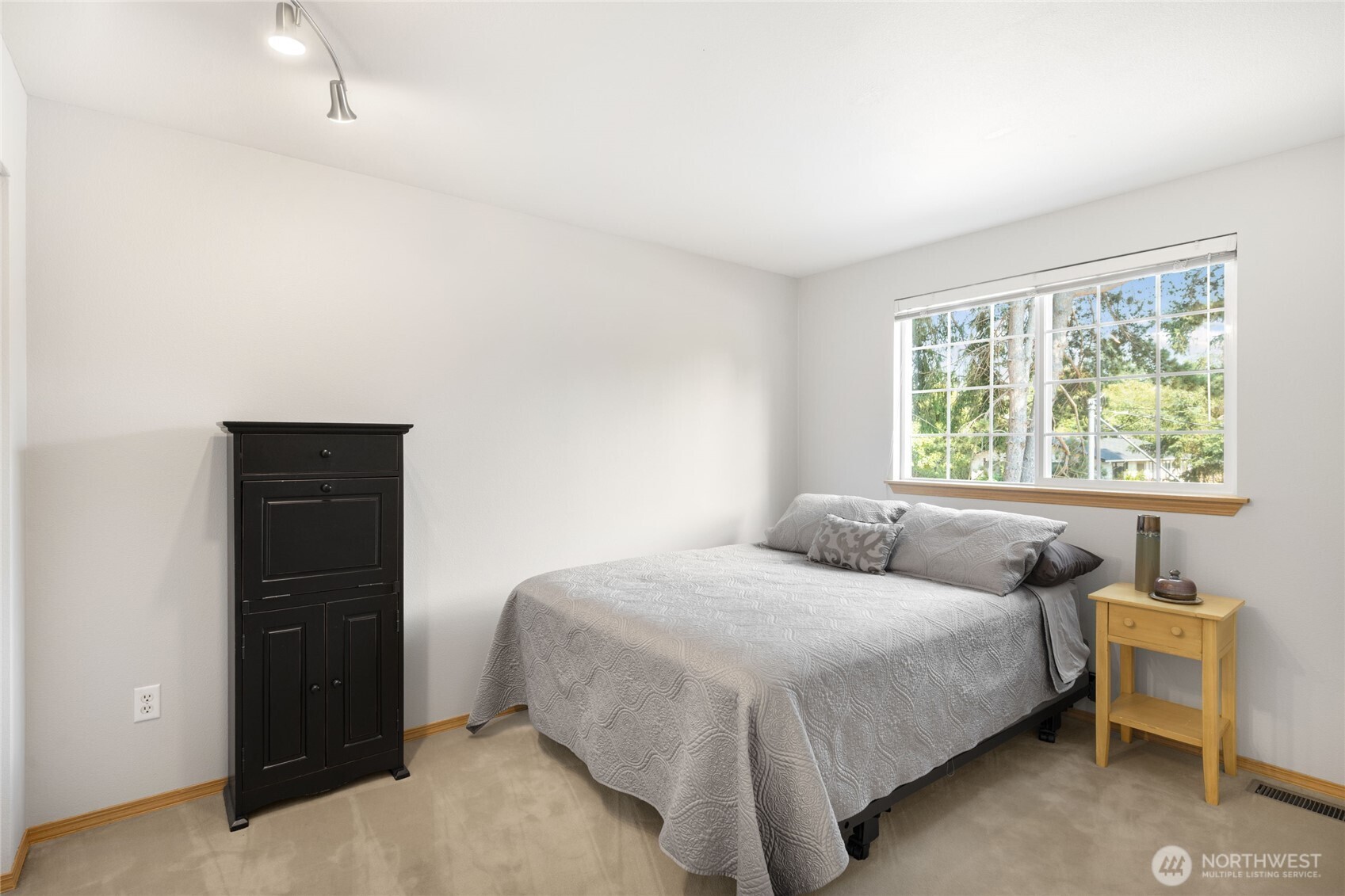 16267 16th Avenue Southwest Burien, WA 98166 - Photo 29 of 40 a bedroom with a bed and a window