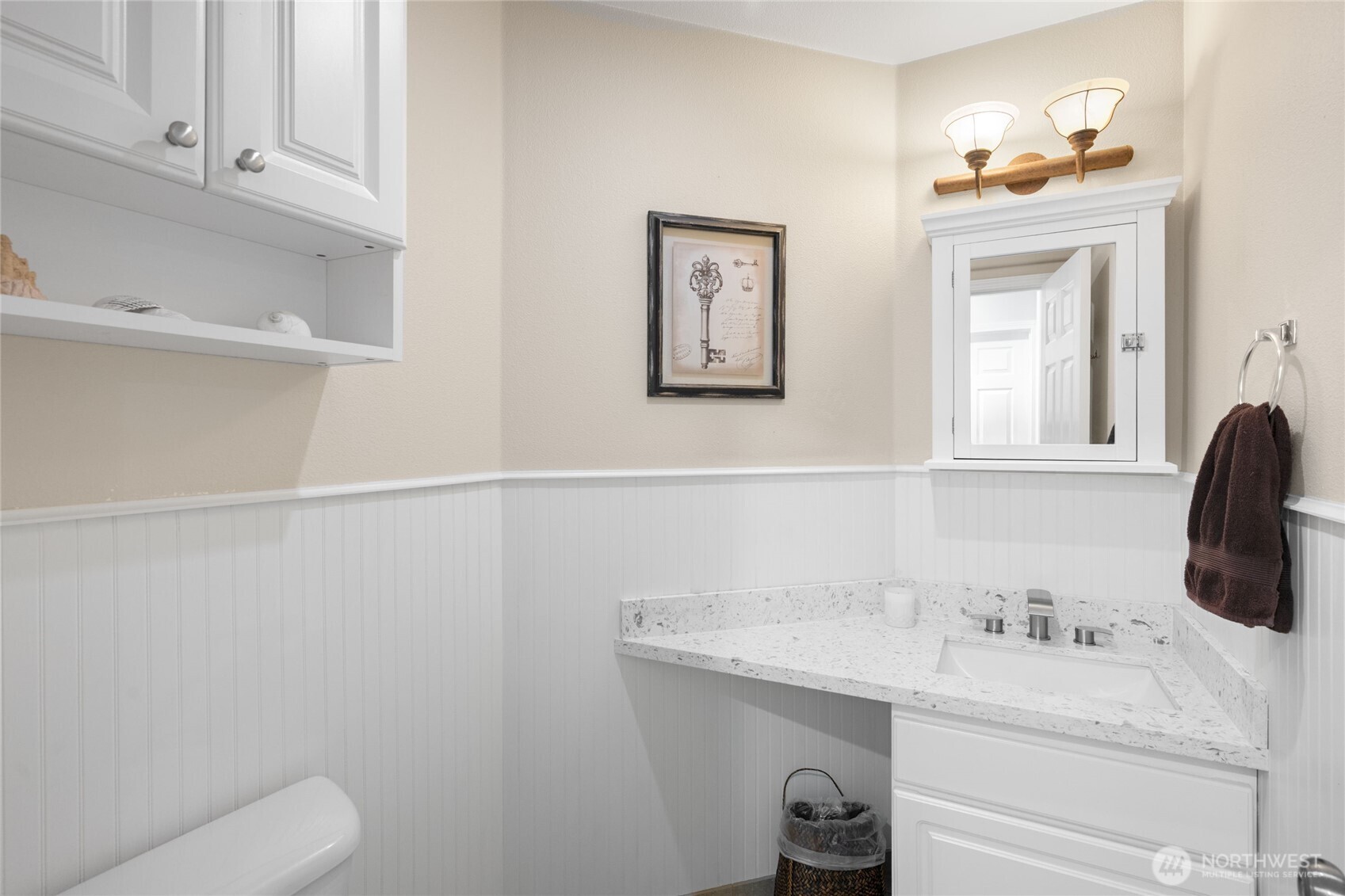 16267 16th Avenue Southwest Burien, WA 98166 - Photo 30 of 40 a bathroom with a sink vanity and toilet
