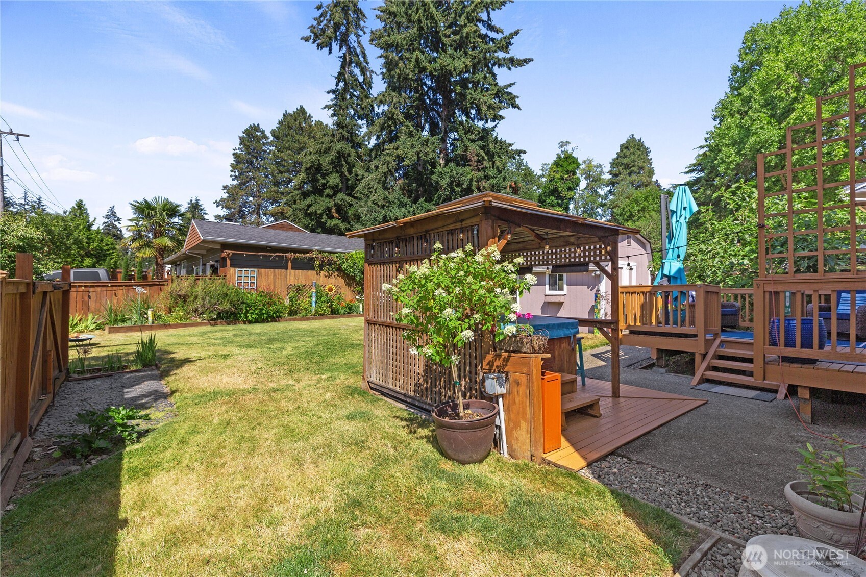 16267 16th Avenue Southwest Burien, WA 98166 - Photo 34 of 40 a backyard of a house with yard and outdoor seating