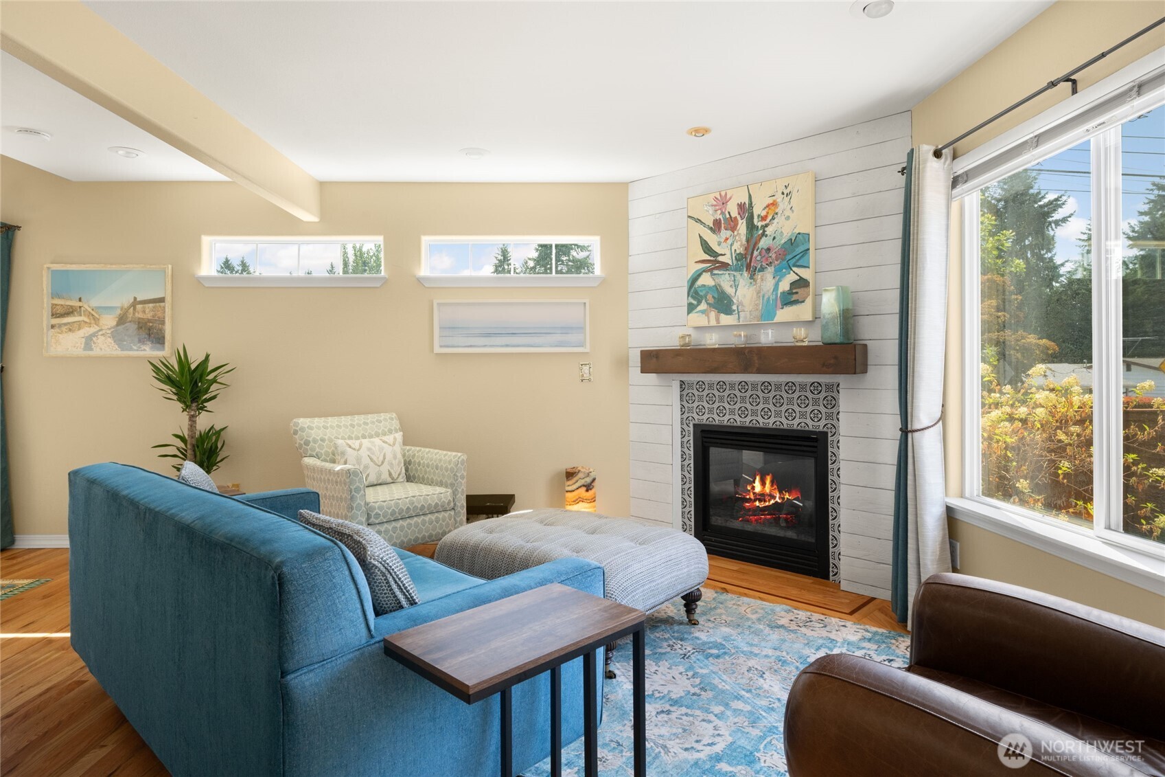 16267 16th Avenue Southwest Burien, WA 98166 - Photo 8 of 40 a living room with furniture a window and a fireplace
