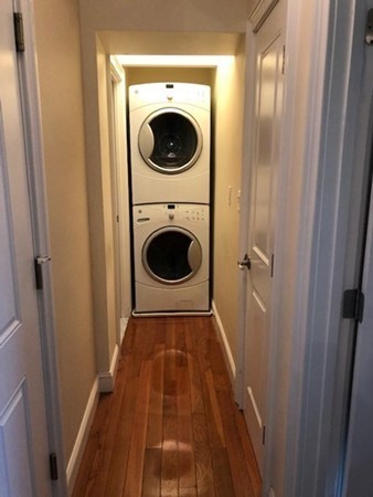 61 Wait Street, Unit 3 Boston, MA 02120 - Photo 8 of 11 a view of a hallway with washer and dryer