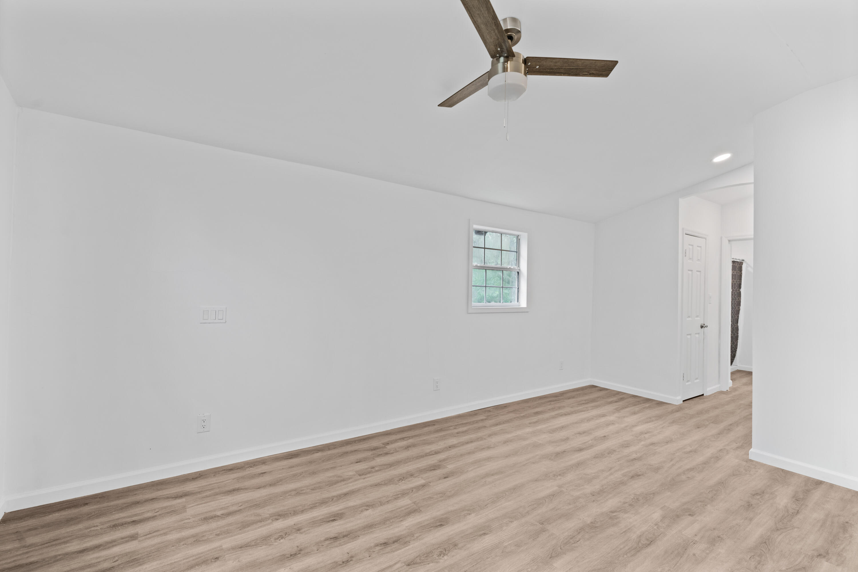 200 East Harborview Road Santa Rosa Beach, FL 32459 - Photo 14 of 20 a view of a room with wooden floor closet and windows