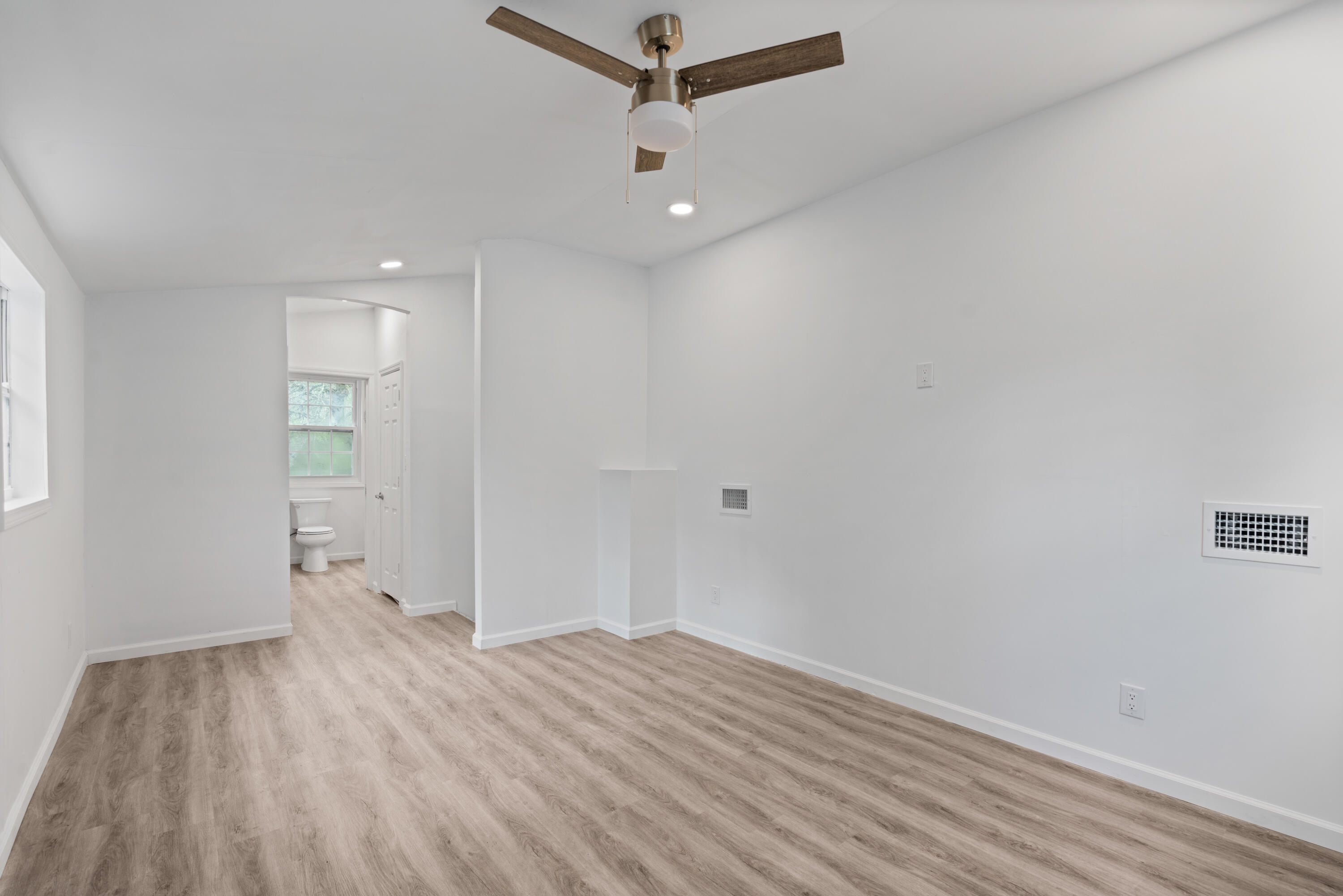 200 East Harborview Road Santa Rosa Beach, FL 32459 - Photo 15 of 20 a view of empty room with wooden floor
