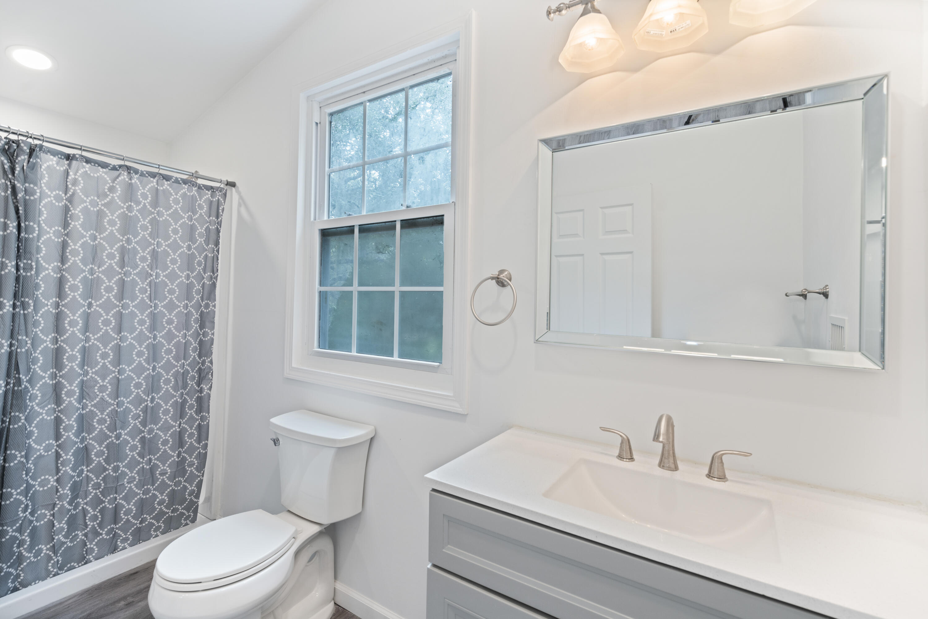 200 East Harborview Road Santa Rosa Beach, FL 32459 - Photo 16 of 20 a bathroom with a sink a toilet and shower