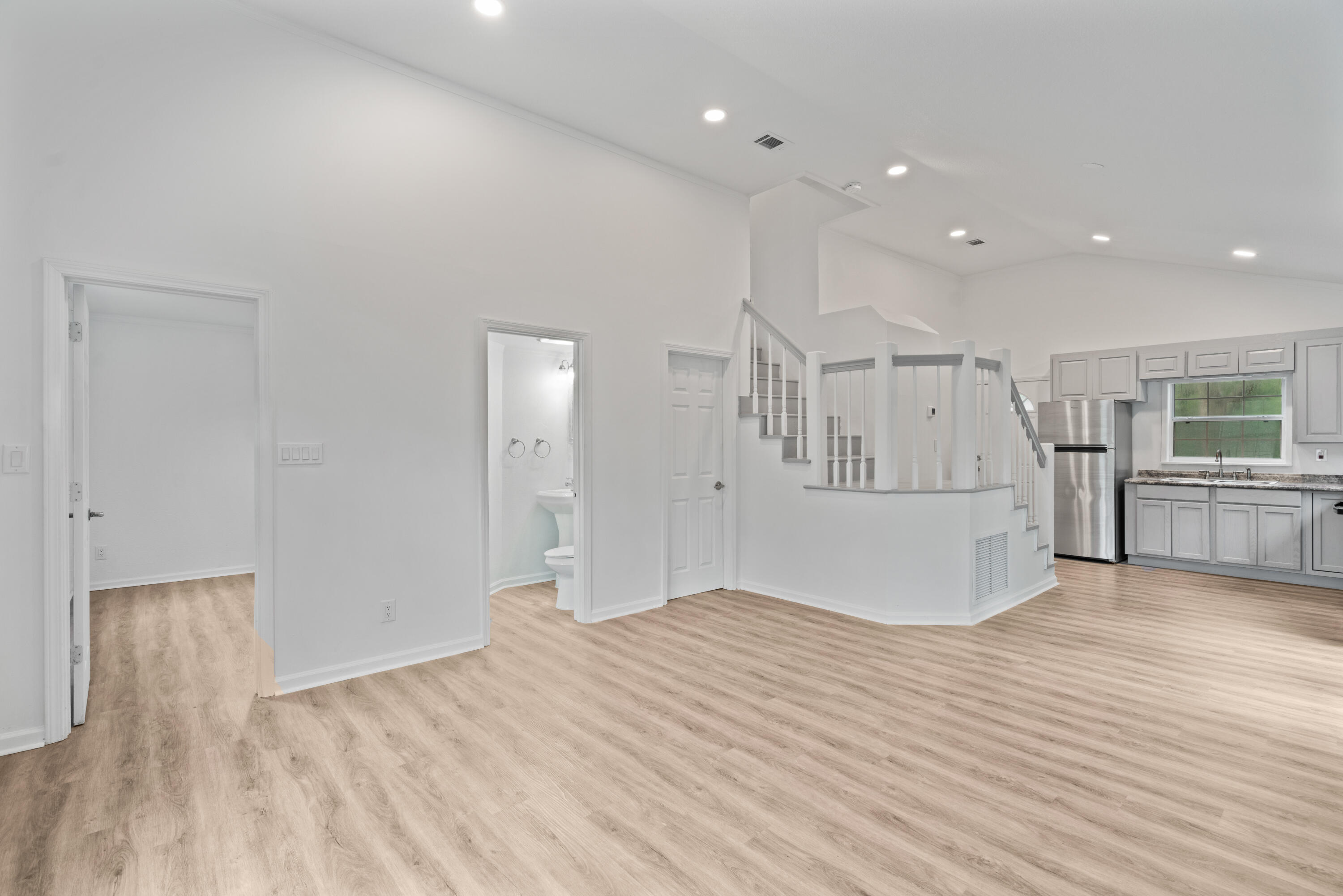 200 East Harborview Road Santa Rosa Beach, FL 32459 - Photo 6 of 20 a view of empty room with wooden floor