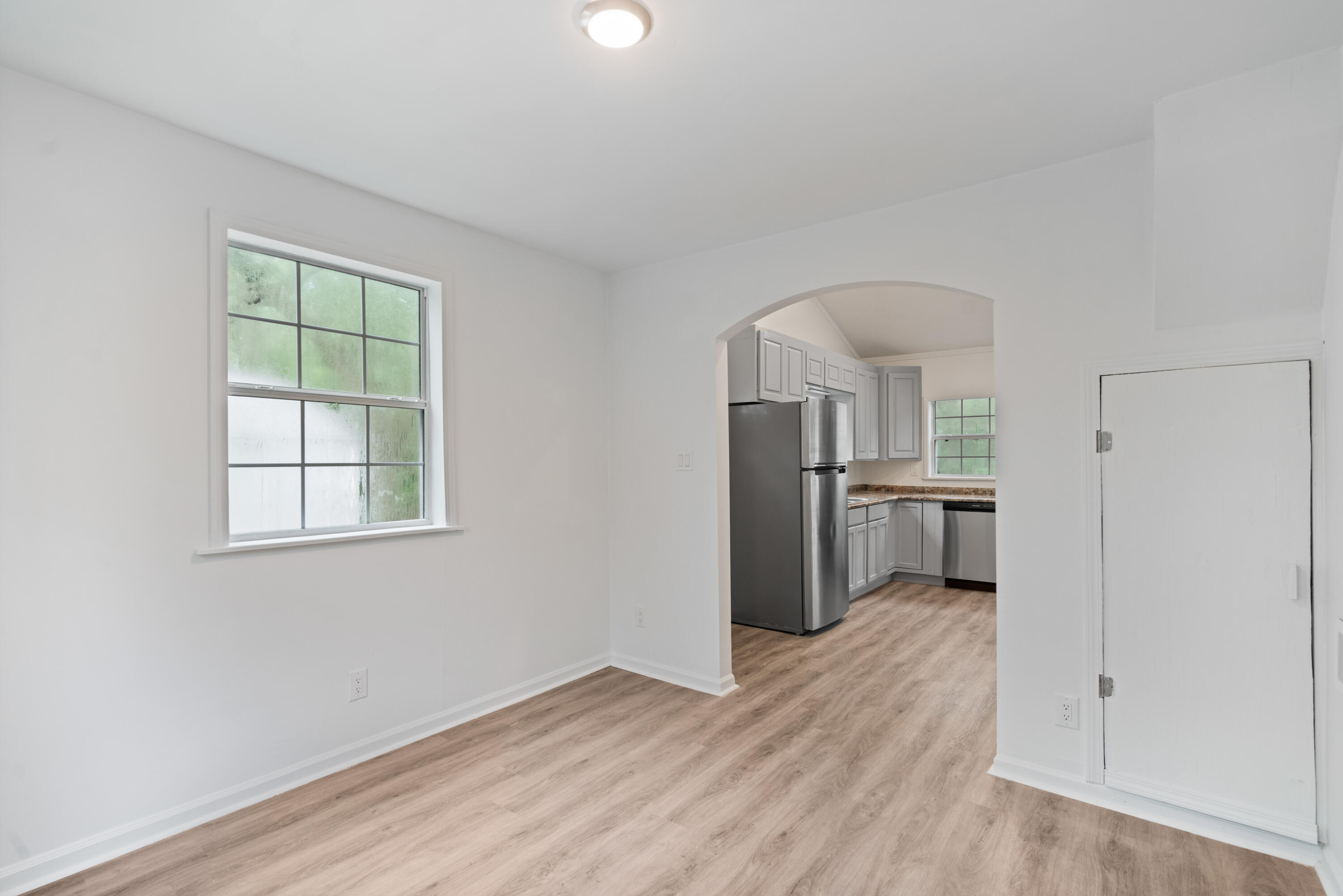 200 East Harborview Road Santa Rosa Beach, FL 32459 - Photo 8 of 20 a view of kitchen with wooden floor electronic appliances and window