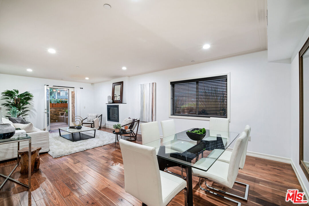 1420 South Bundy Drive, Unit 101 Los Angeles, CA 90025 - Photo 12 of 37 a living room with furniture floor and window