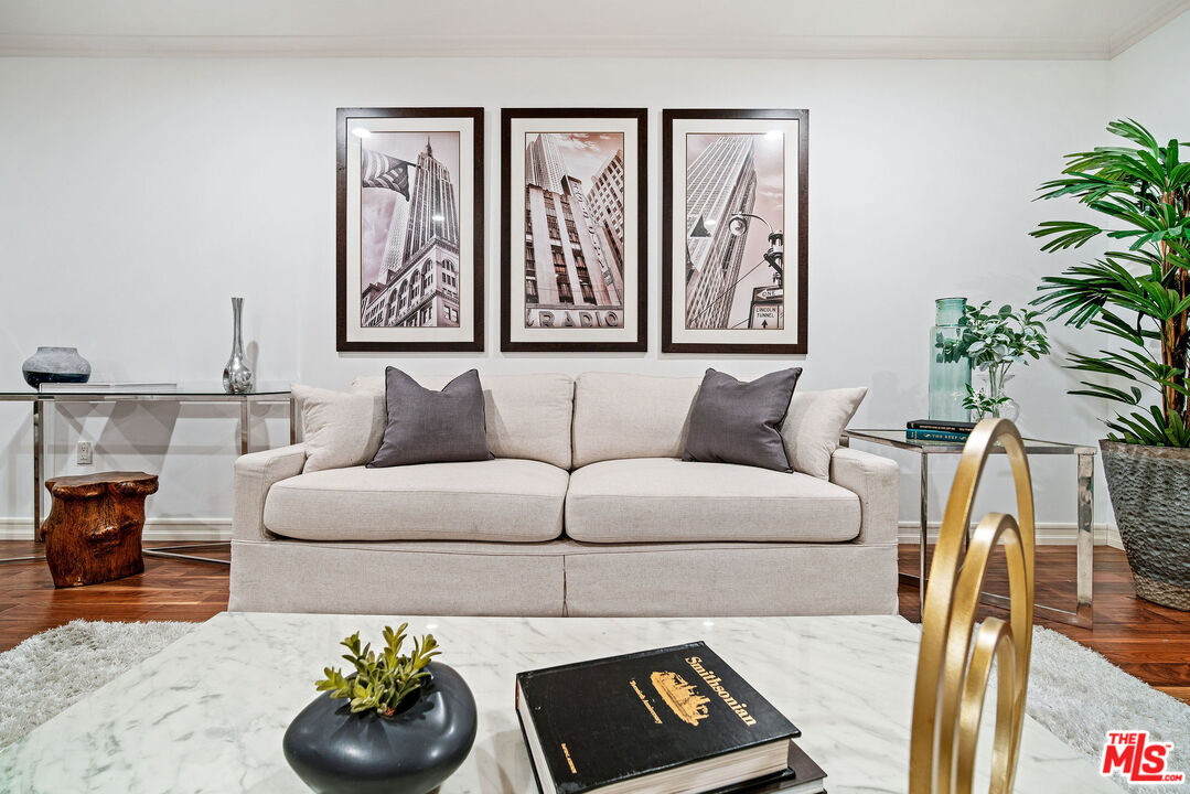 1420 South Bundy Drive, Unit 101 Los Angeles, CA 90025 - Photo 16 of 37 a living room with furniture and a potted plant