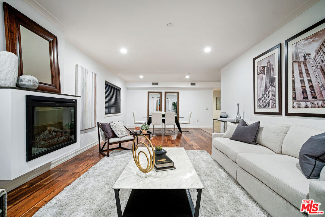 1420 South Bundy Drive, Unit 101 Los Angeles, CA 90025 - Photo 17 of 37 a living room with furniture and a fireplace