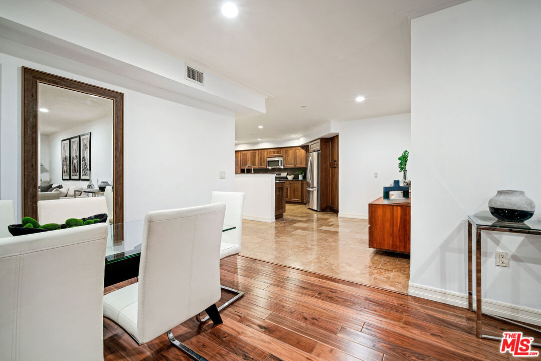 1420 South Bundy Drive, Unit 101 Los Angeles, CA 90025 - Photo 24 of 37 a living room with furniture and a view of kitchen