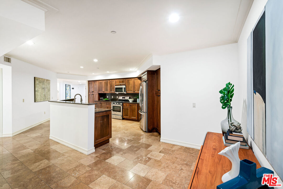 1420 South Bundy Drive, Unit 101 Los Angeles, CA 90025 - Photo 25 of 37 a view of kitchen with furniture and refrigerator