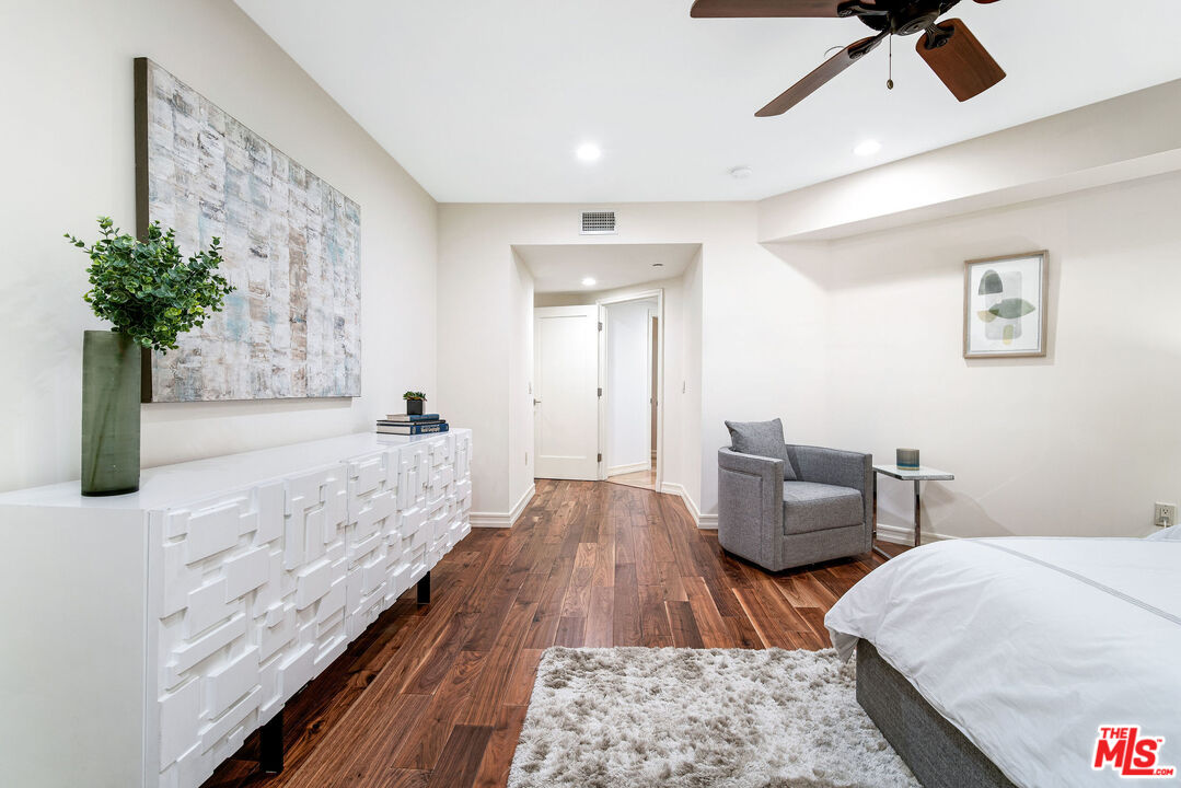 1420 South Bundy Drive, Unit 101 Los Angeles, CA 90025 - Photo 29 of 37 a spacious bedroom with bed and a couch