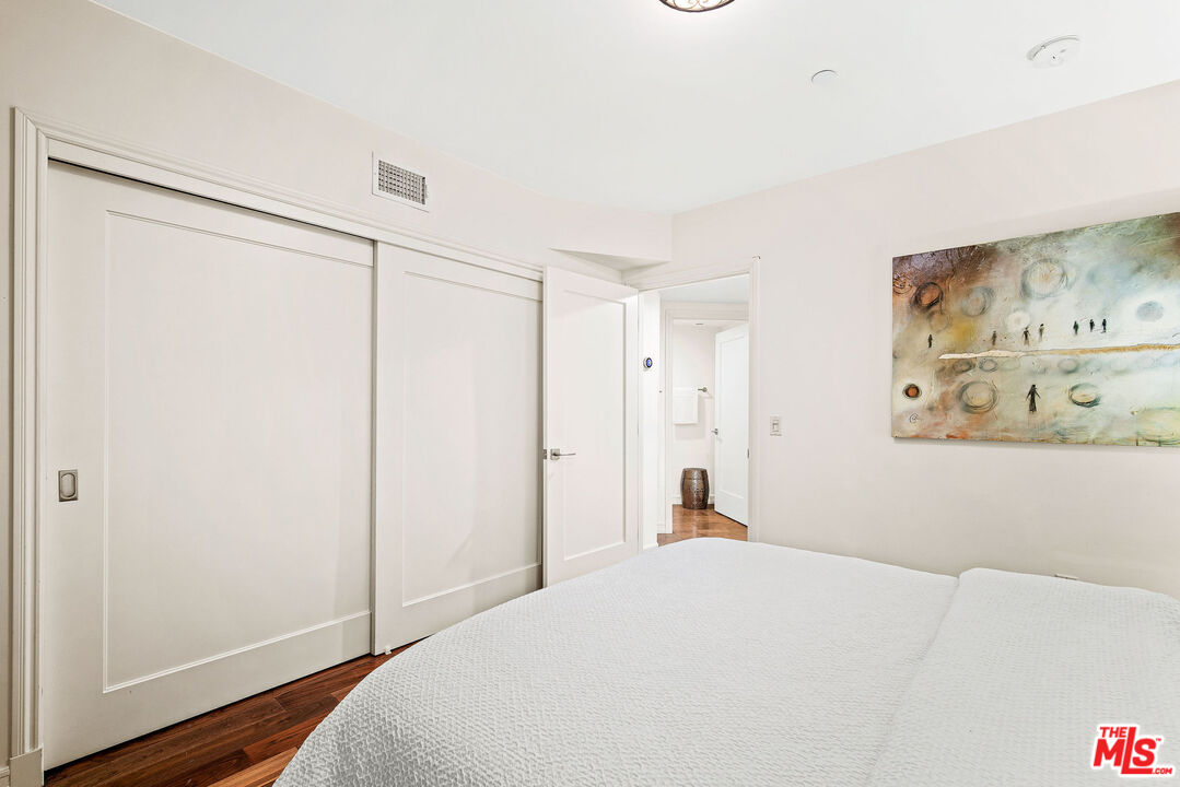 1420 South Bundy Drive, Unit 101 Los Angeles, CA 90025 - Photo 36 of 37 a bedroom with a bed and a window