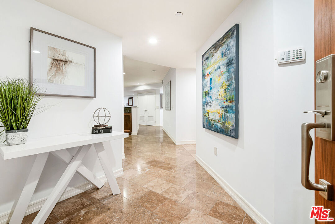 1420 South Bundy Drive, Unit 101 Los Angeles, CA 90025 - Photo 6 of 37 a view of a hallway with workspace