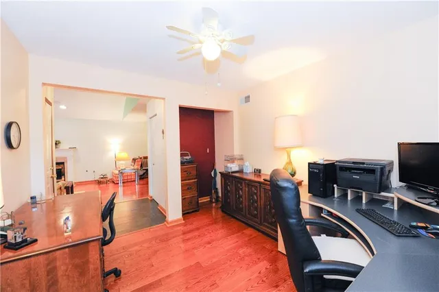 a view of a livingroom with furniture and a flat screen tv