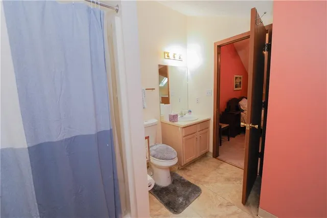 a bathroom with a toilet and a sink