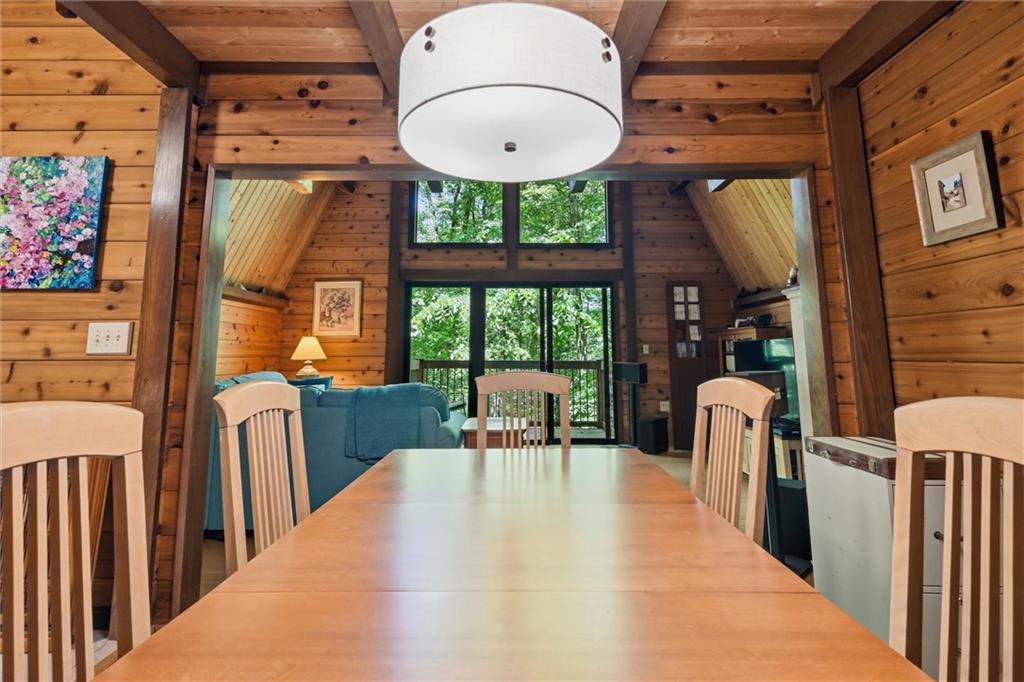 6110 Saltsburg Road Murrysville, PA 15668 - Photo 8 of 47 a view of a dining room with furniture a chandelier and wooden floor