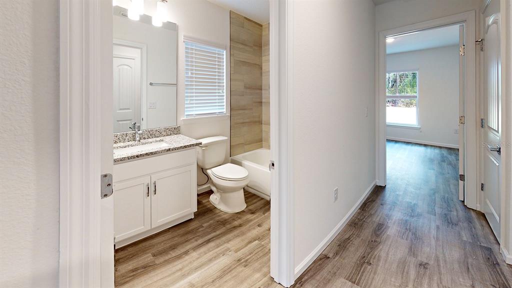7 Pinto Lane Palm Coast, FL 32164 - Photo 12 of 13 a bathroom with a sink and a mirror