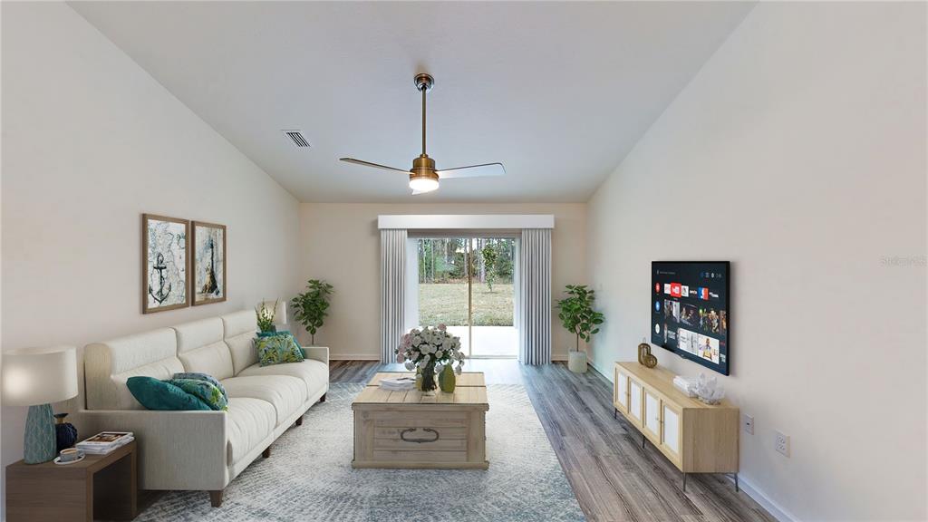 7 Pinto Lane Palm Coast, FL 32164 - Photo 7 of 13 a living room with furniture and a large window