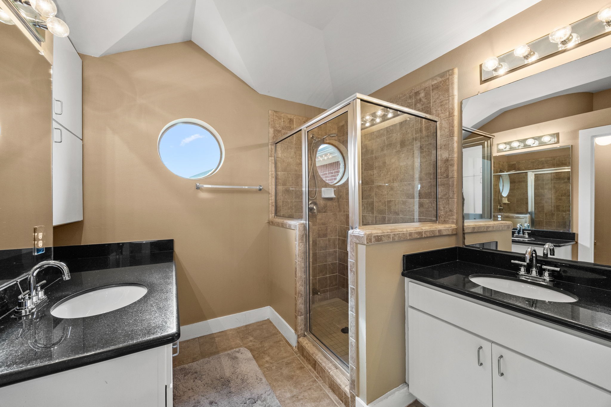 5951 S Loop East, Unit 7 Houston, TX 77033 - Photo 13 of 22 a bathroom with a granite countertop sink and a mirror
