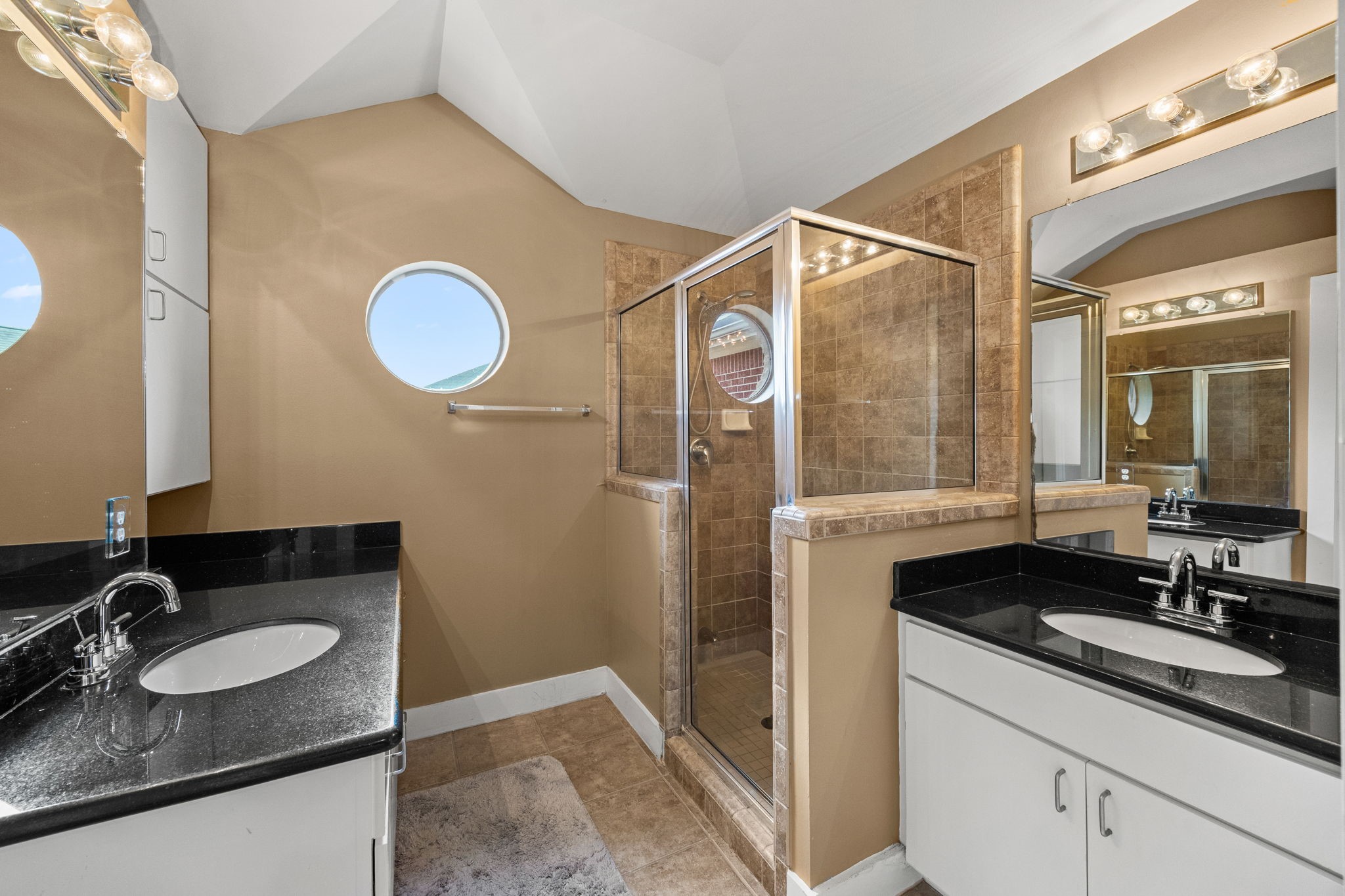 5951 S Loop East, Unit 7 Houston, TX 77033 - Photo 14 of 22 a bathroom with a granite countertop sink and a mirror