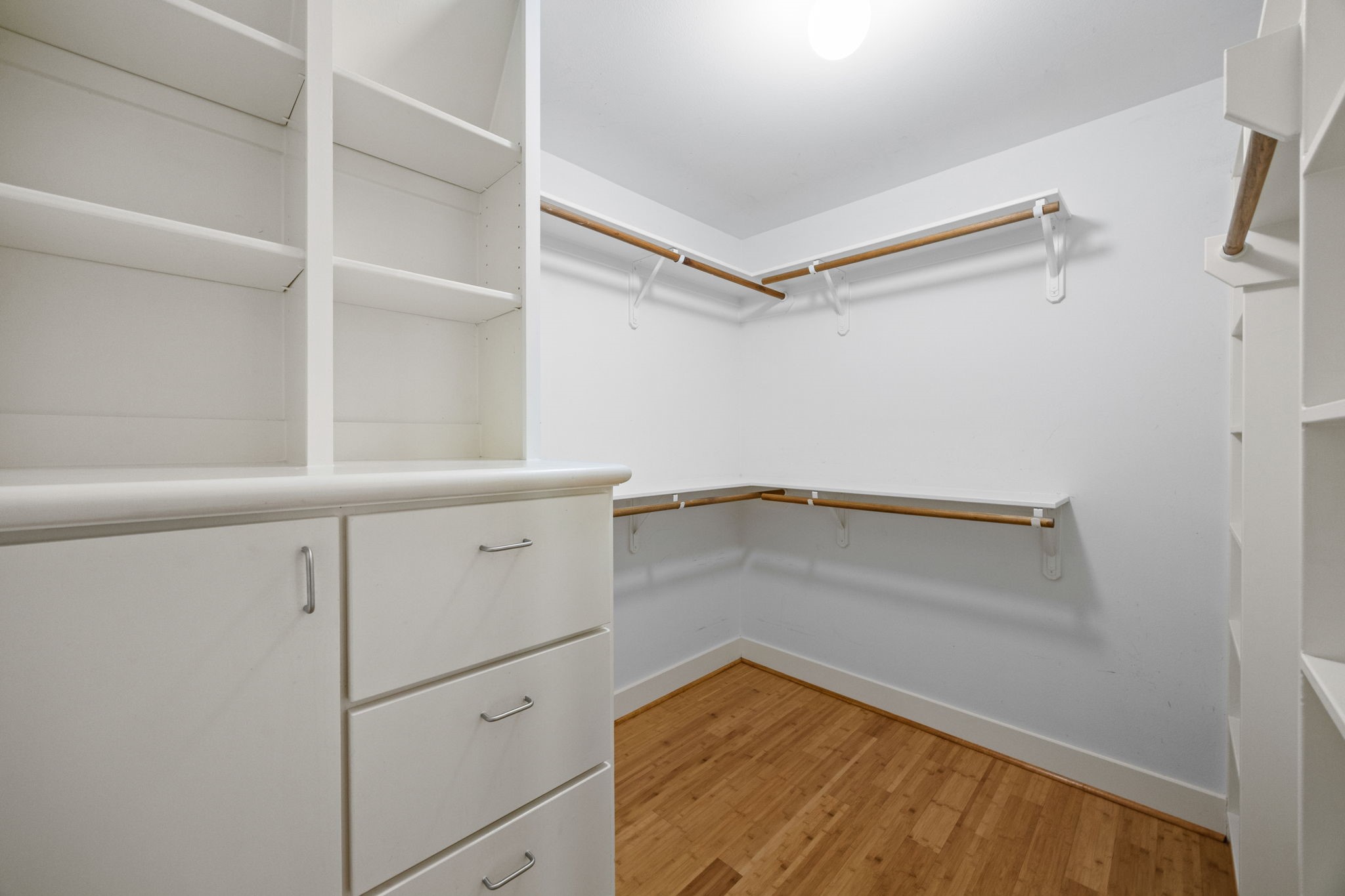 5951 S Loop East, Unit 7 Houston, TX 77033 - Photo 15 of 22 a view of walk in closet with empty racks