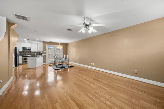 a view of kitchen with furniture and wooden floor