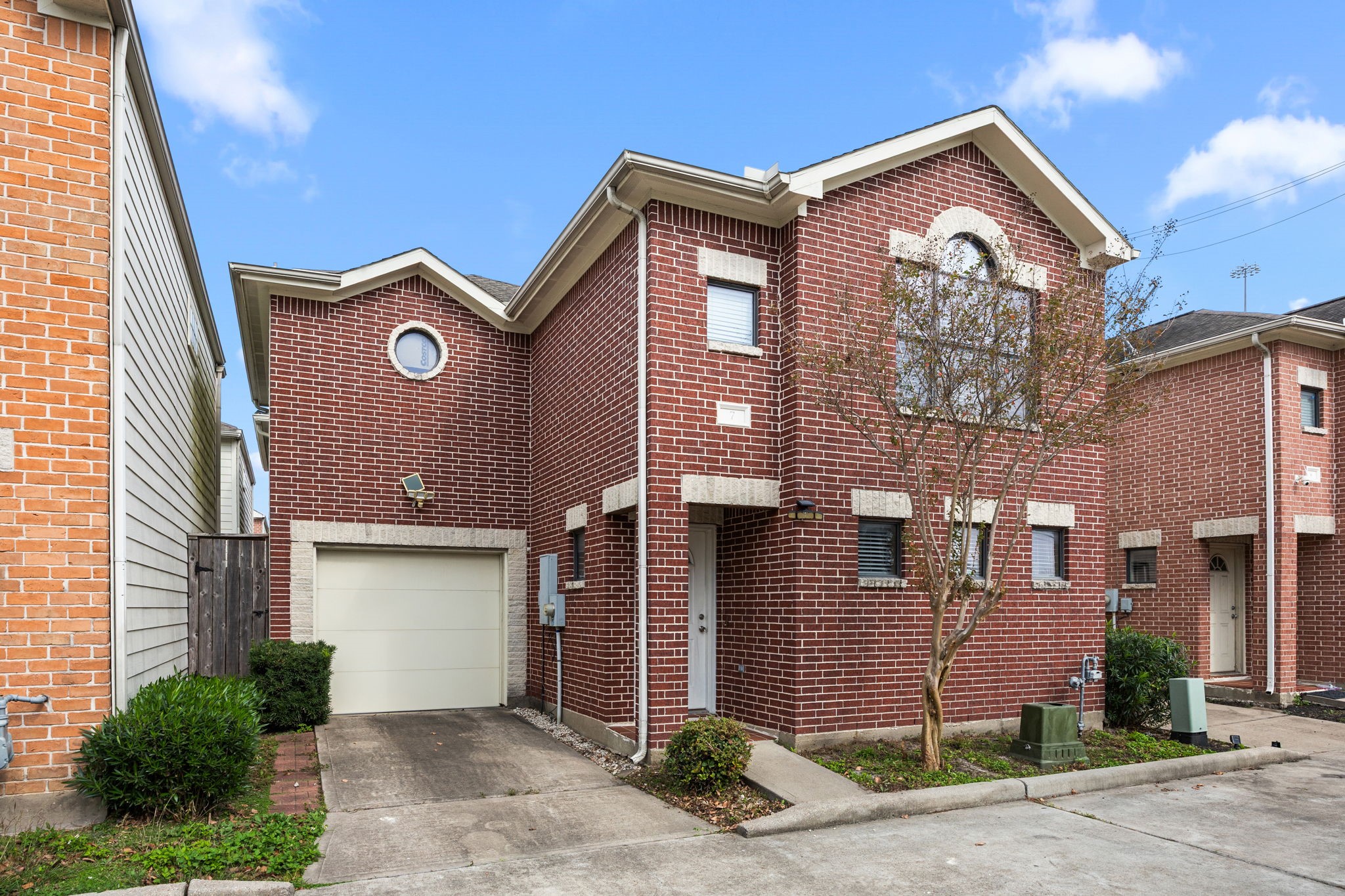 5951 S Loop East, Unit 7 Houston, TX 77033 - Photo 21 of 22 a front view of a house with a garage