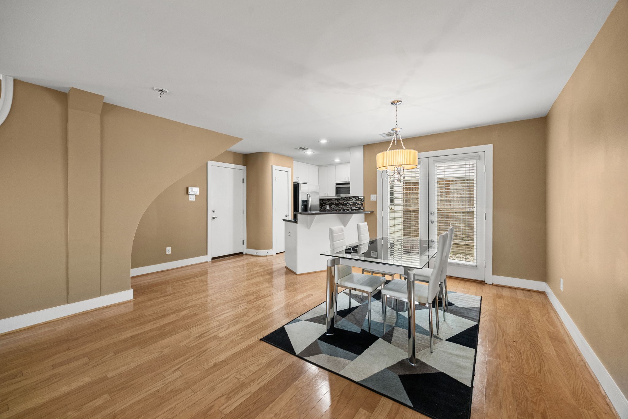 5951 S Loop East, Unit 7 Houston, TX 77033 - Photo 5 of 22 a view of a dining room with furniture window and wooden floor