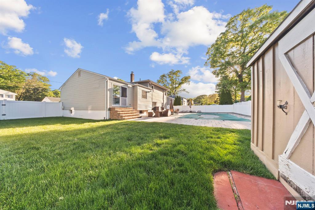 62 Sycamore Road Dumont, NJ 07628 - Photo 32 of 43 a view of an house with backyard space and balcony