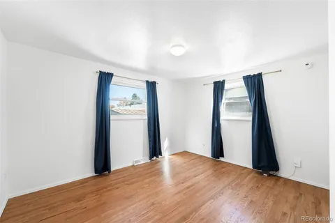 a view of a big room with closet and wooden floor