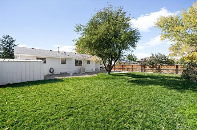 a view of a backyard with garden