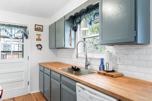 a kitchen with a sink and a window