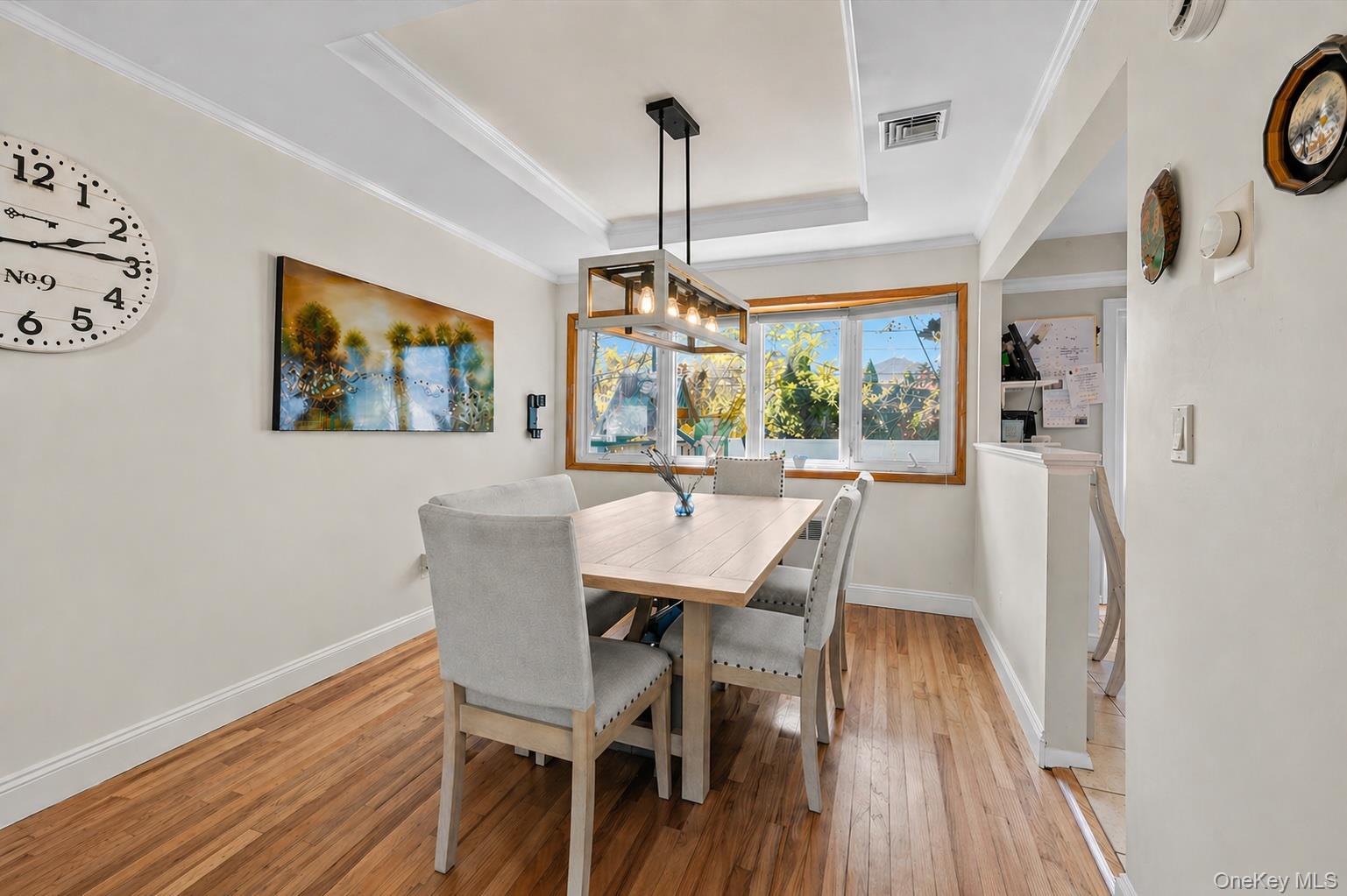 61 Winthrop Road Plainview, NY 11803 - Photo 5 of 37 a view of a dining room with furniture window and wooden floor