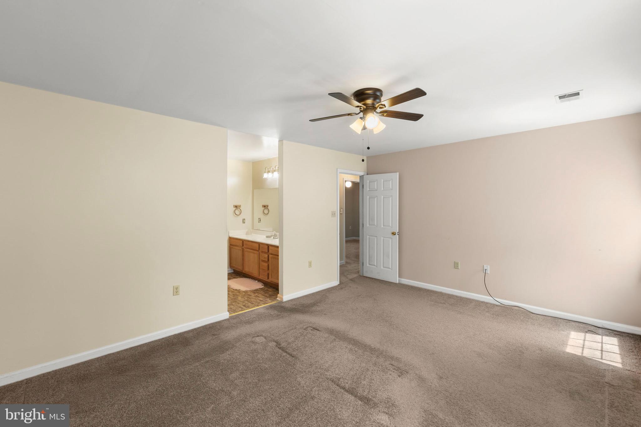 430 Babbs Mountain Road Winchester, VA 22603 - Photo 25 of 49 an empty room with a ceiling fan and a window
